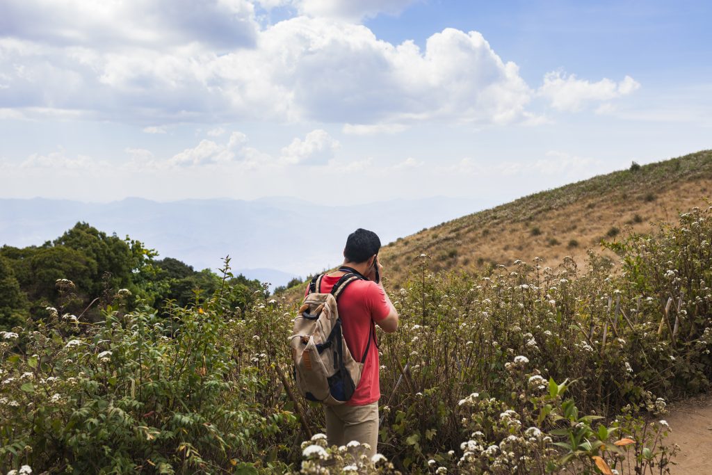 Hiker taking photo in field
https://www.freepik.com/free-photo/hiker-taking-photo-fields_1110390.htm