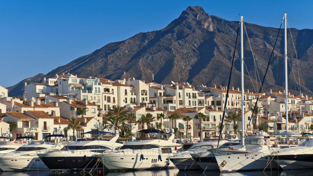 Puerto Banus port with mountain behind.